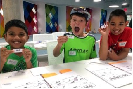 kids at table with activity